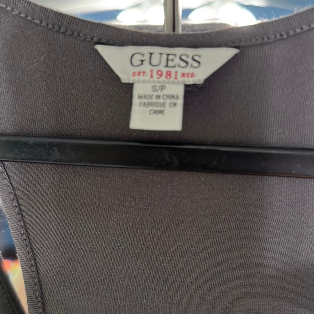 A gray guest race back fitting dress